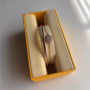 Swarovski Sublima Rose Gold Bangle with clear round crystals.